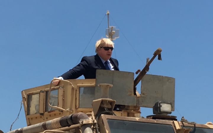 As Parliament argues over the National Insurance U-turn, Boris Johnson rides an armoured vehicle in Mogadishu